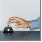 Man ringing bell on counter for service